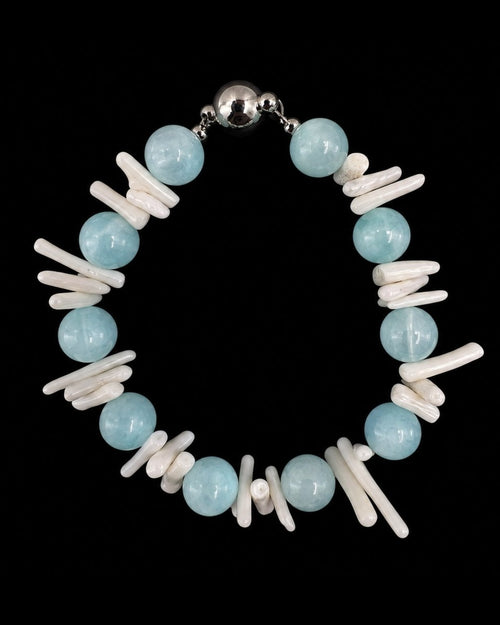 Aqua Shell Pearl Bracelet on a black background
