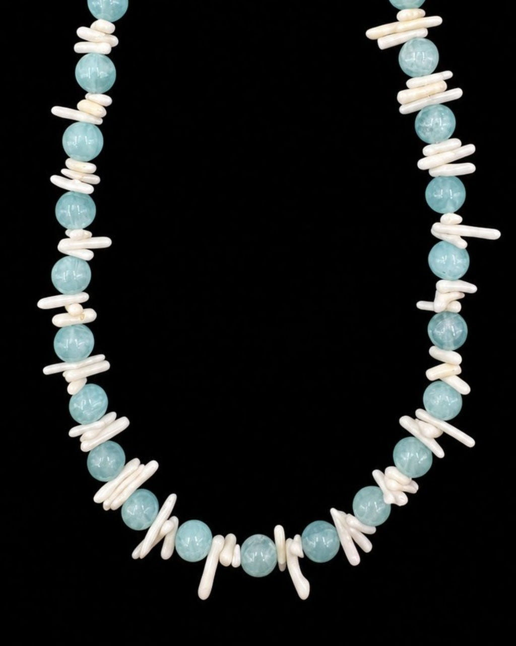 Aqua Shell Pearl Necklace on a black background