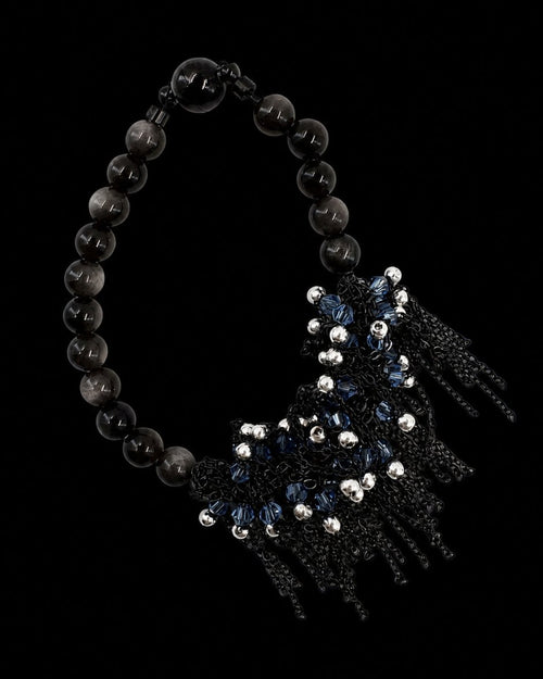 Black Blue Chain Tassel Bracelet on a black background