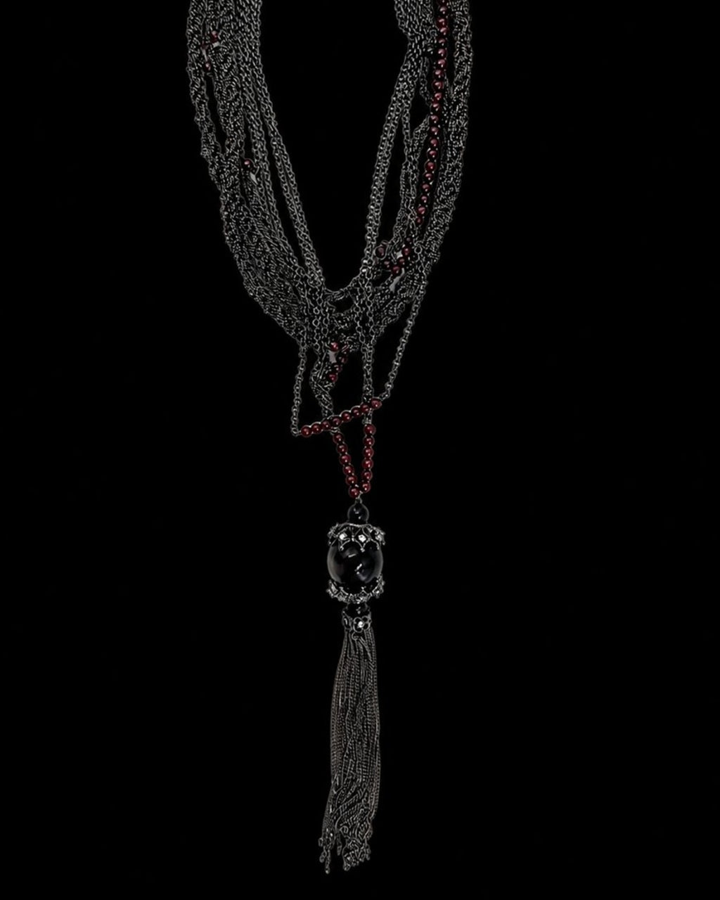 Black Burgundy Tassel Necklace on a black background
