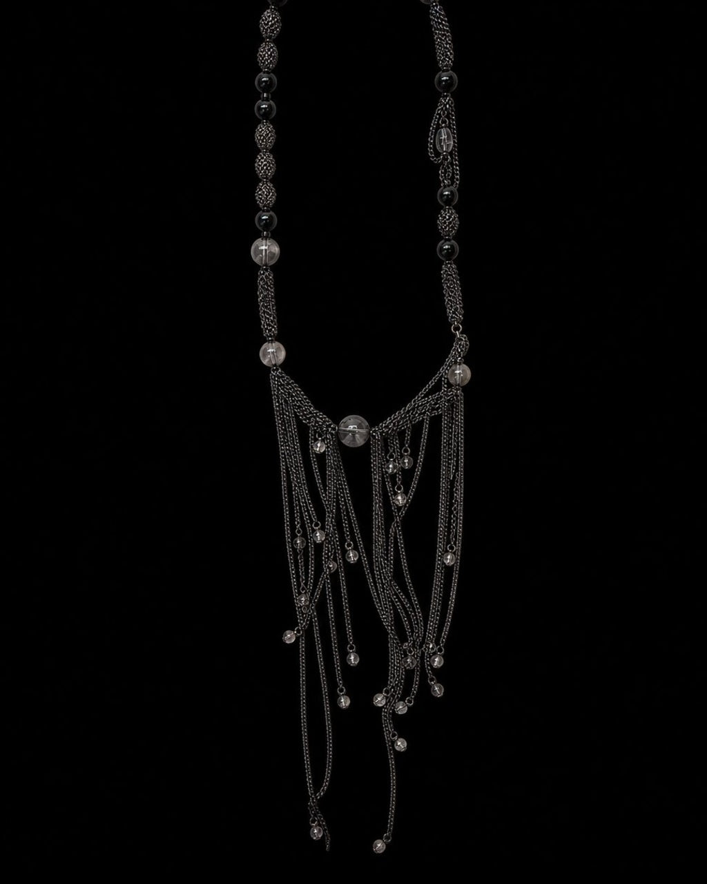 Black Gray Bead Chain Tassel Necklace on a black background
