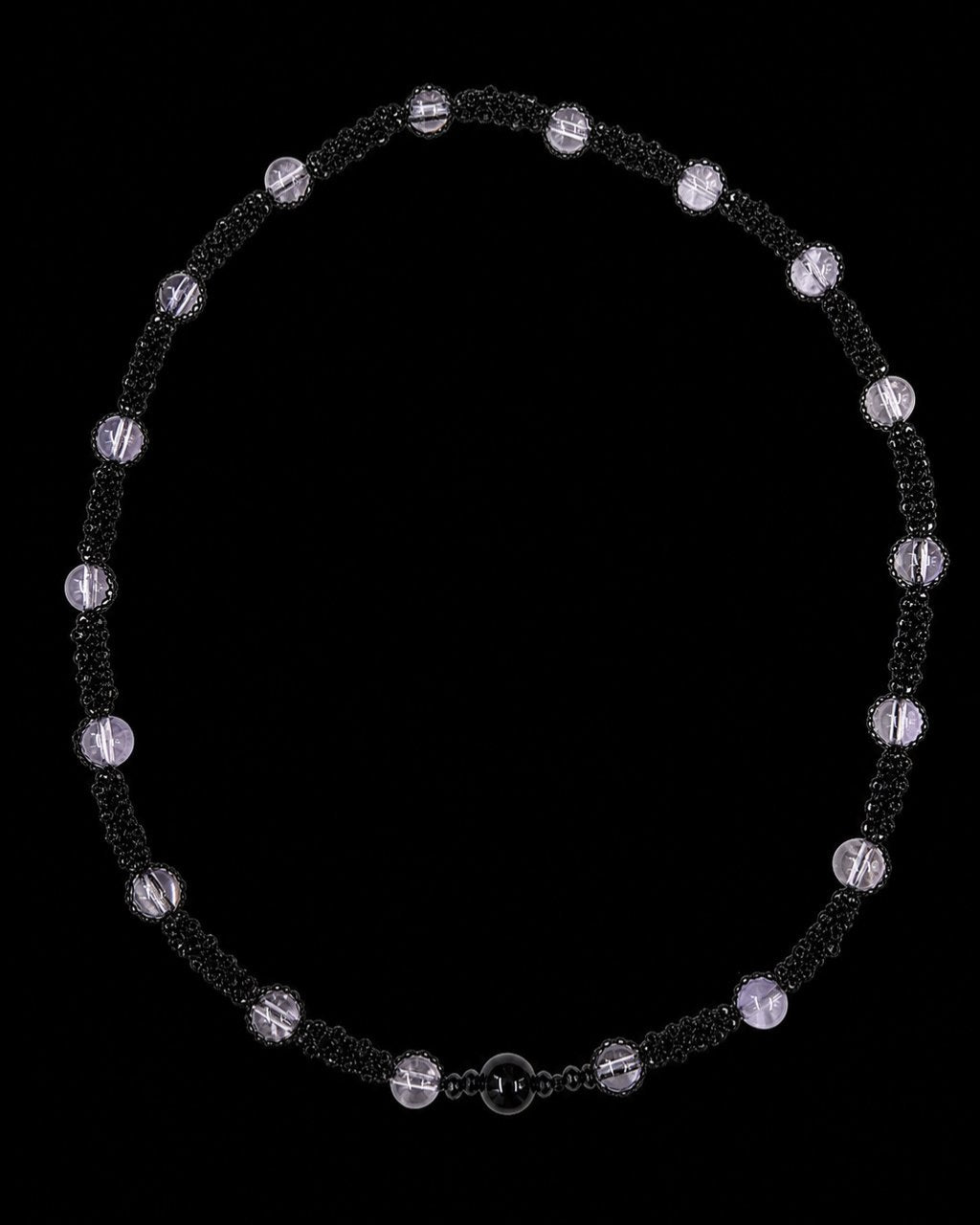 Black Lavender Bead Necklace on a black background