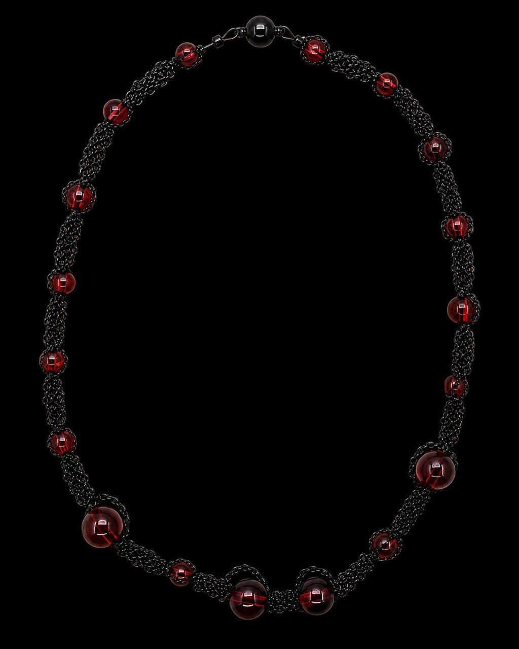 Black Red Bead Chain Necklace on a black background