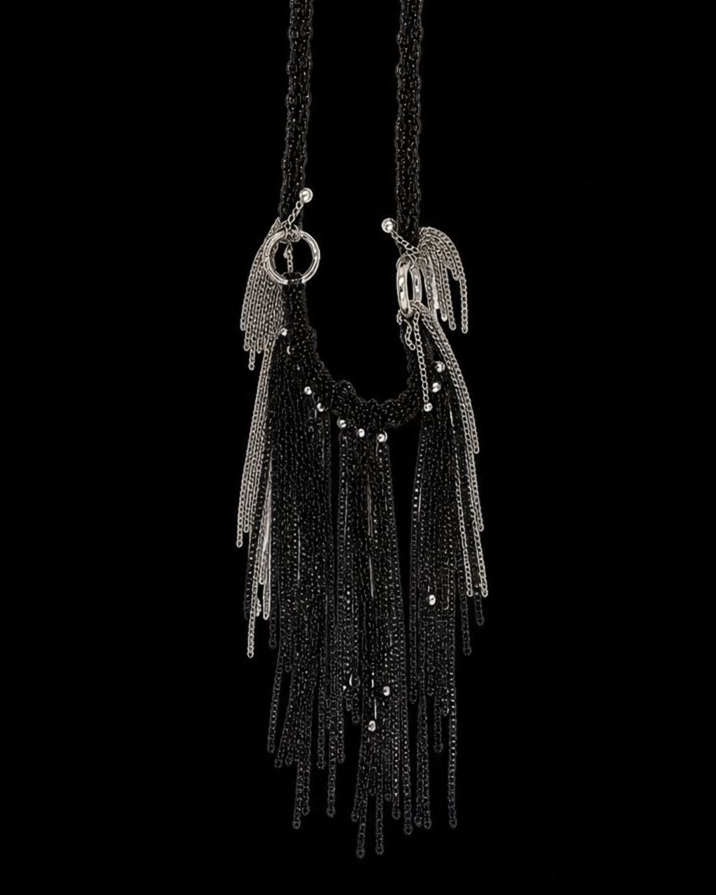 Black Silver Chain Tassel Necklace on a black background