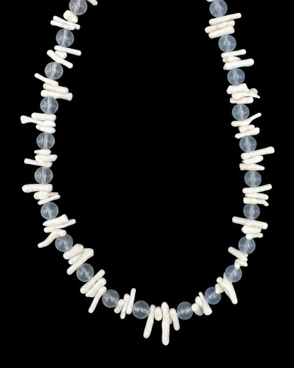 Blue White Shell Pearl Necklace on a black background