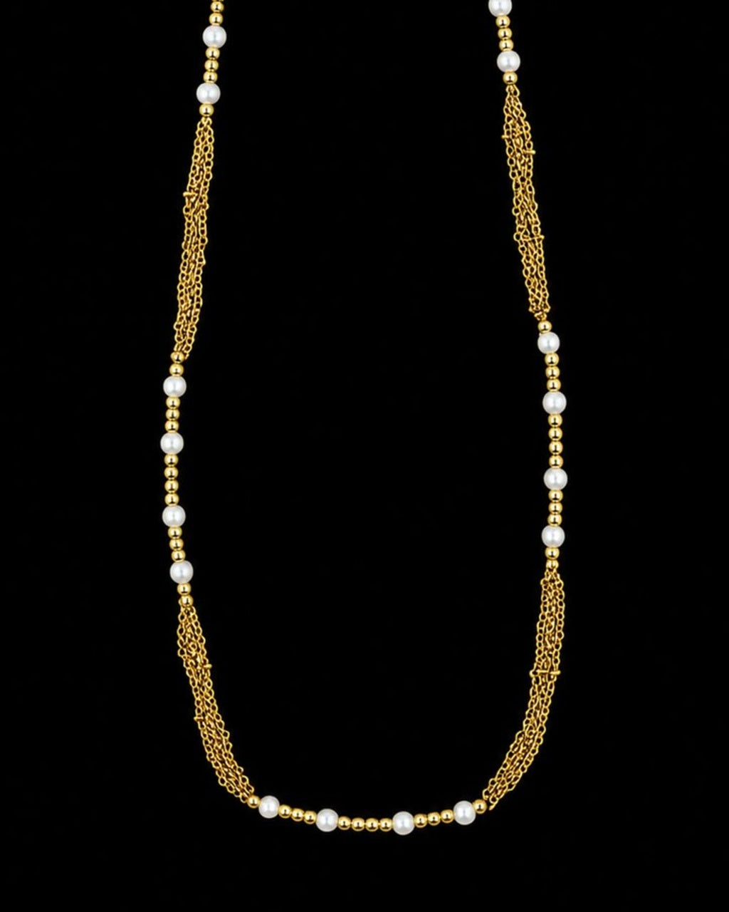 Gold Pearl Chain Necklace on a black background