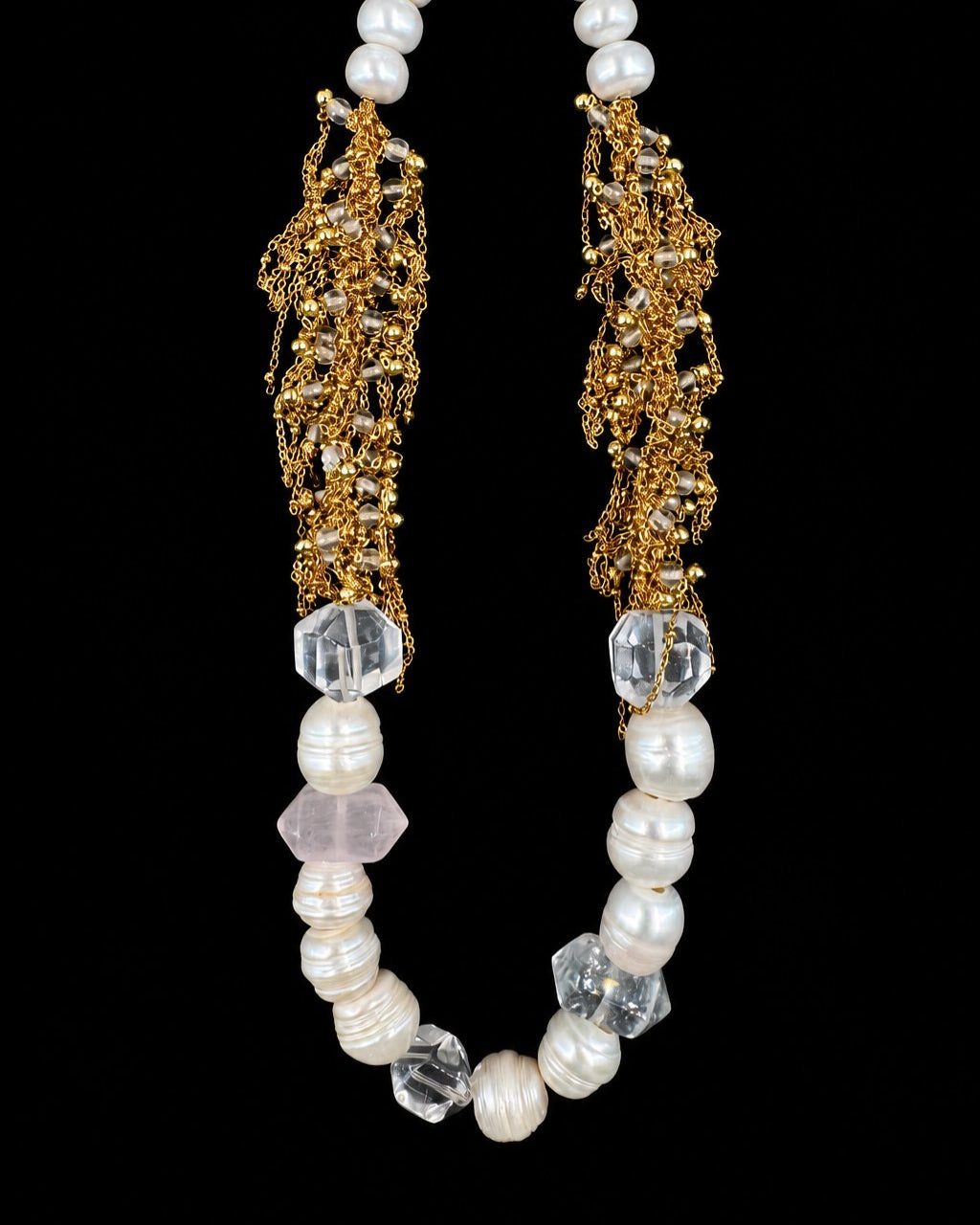Gold Pearl Crystal Necklace on a black background