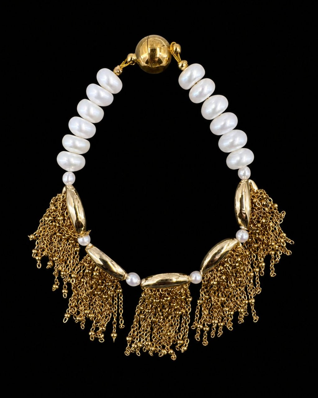 Gold Pearl Tassel Bracelet on a black background