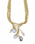 Gold Shell Charm Necklace on a white background