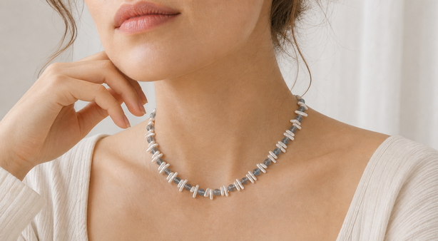 Model wearing a fine layered necklace